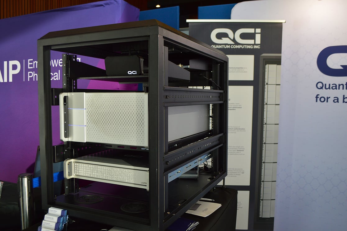 Dirac-3 at QCi Booth for QWC 2024